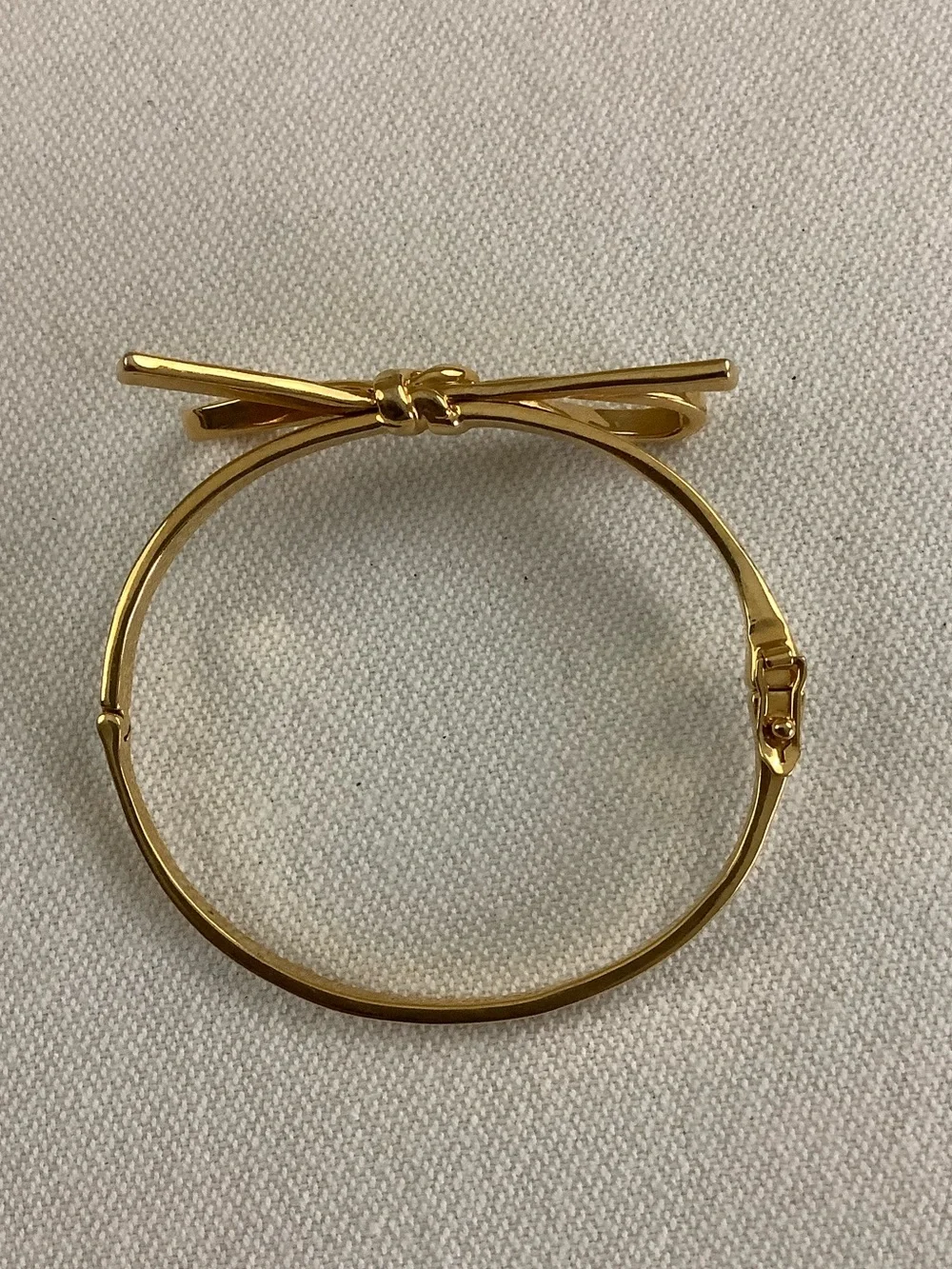 kate spade gold-tone bow hinged bangle bracelet